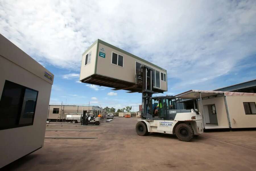 Forklift Lifting A Demountable Building